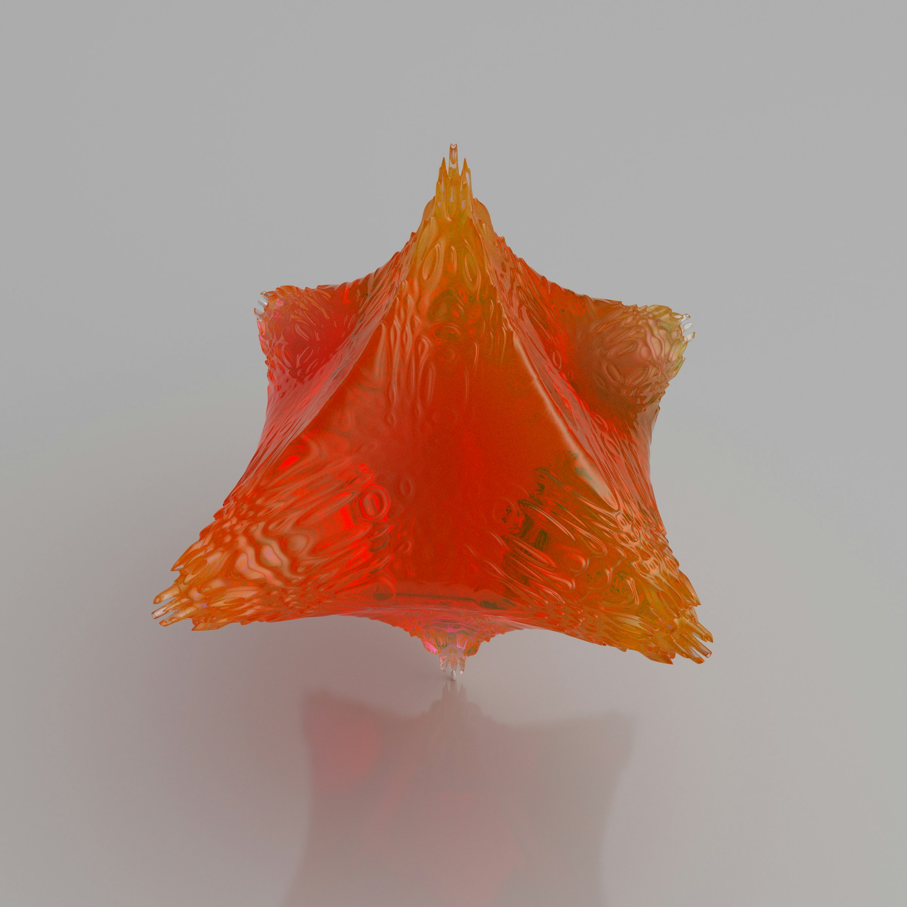 Folded red glass catching light against a soft neutral surface